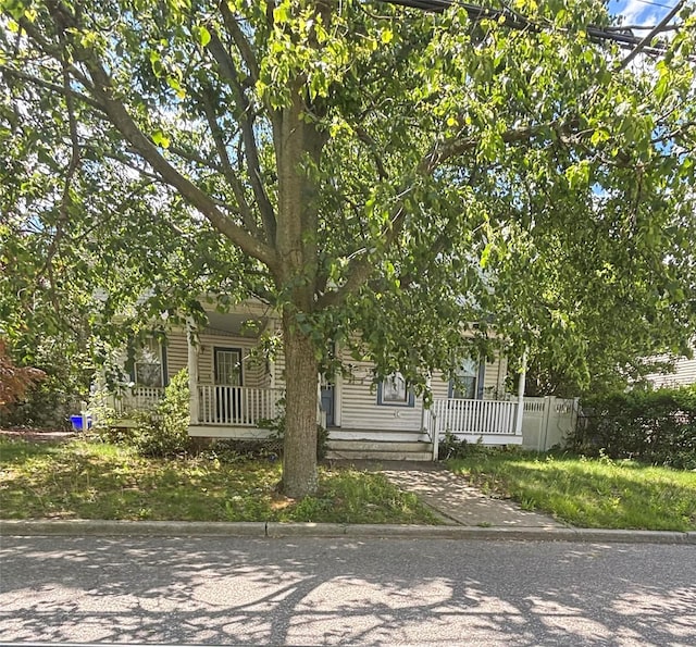 252 Locust Ave, Babylon, NY 11702 - view of property hidden behind natural elements with covered porch