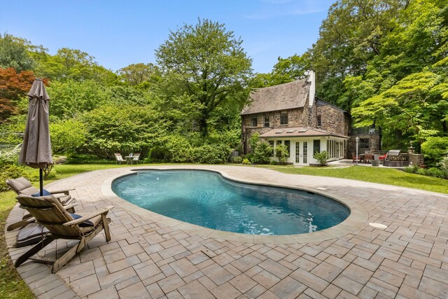 100 Mount Airy Rd S, Croton-On-Hudson, NY 10520 - swimming pool featuring french doors, a patio, an exterior structure, an outbuilding, and a lawn