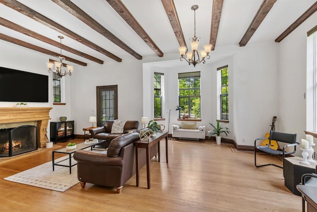100 Mount Airy Rd S, Croton-On-Hudson, NY 10520 - living room with a chandelier, light wood-style floors, baseboards, and beamed ceiling