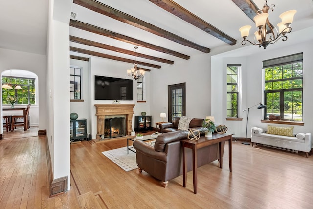 100 Mount Airy Rd S, Croton-On-Hudson, NY 10520 - living area featuring a chandelier, light wood-type flooring, plenty of natural light, beam ceiling, and baseboards
