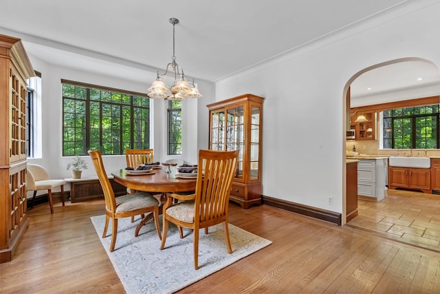 100 Mount Airy Rd S, Croton-On-Hudson, NY 10520 - dining room featuring arched walkways, light wood-style flooring, a chandelier, baseboards, and recessed lighting