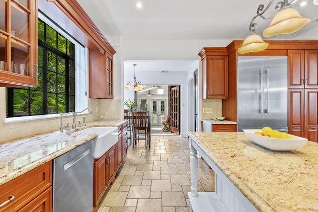 100 Mount Airy Rd S, Croton-On-Hudson, NY 10520 - kitchen featuring appliances with stainless steel finishes, stone tile flooring, a sink, decorative backsplash, and recessed lighting