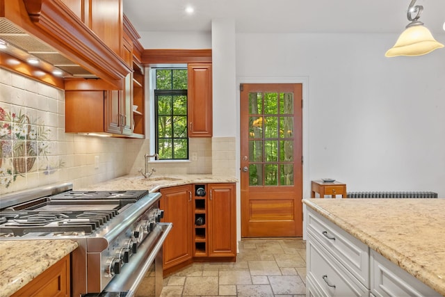 100 Mount Airy Rd S, Croton-On-Hudson, NY 10520 - kitchen with high end stainless steel range, custom range hood, a sink, stone tile flooring, and decorative backsplash