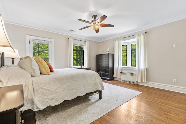 100 Mount Airy Rd S, Croton-On-Hudson, NY 10520 - bedroom featuring radiator, wood finished floors, baseboards, ornamental molding, and ceiling fan