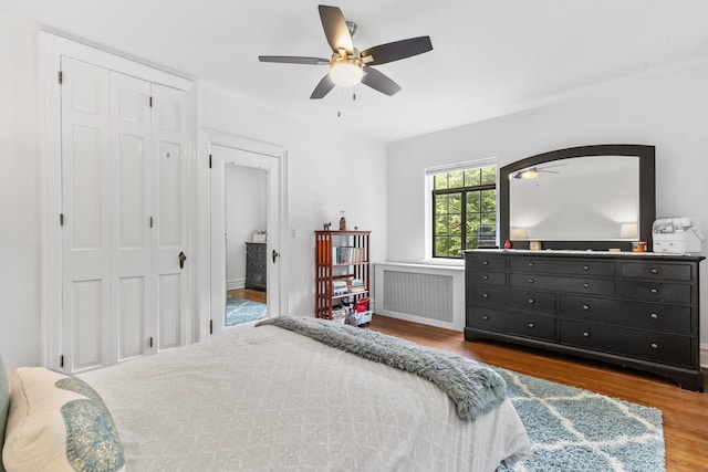 100 Mount Airy Rd S, Croton-On-Hudson, NY 10520 - bedroom featuring radiator heating unit, wood finished floors, a closet, and a ceiling fan