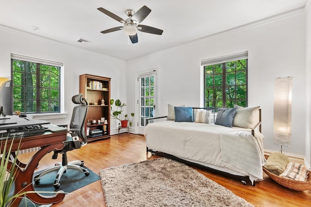 100 Mount Airy Rd S, Croton-On-Hudson, NY 10520 - bedroom with an office area, ornamental molding, wood finished floors, multiple windows, and ceiling fan