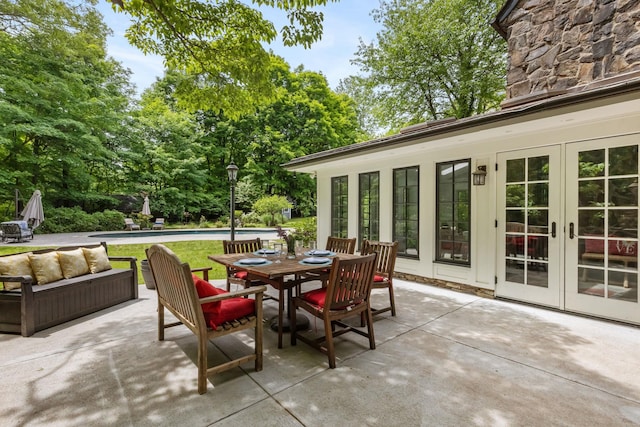 100 Mount Airy Rd S, Croton-On-Hudson, NY 10520 - view of patio with french doors, an outdoor living space, an outdoor pool, and outdoor dining area