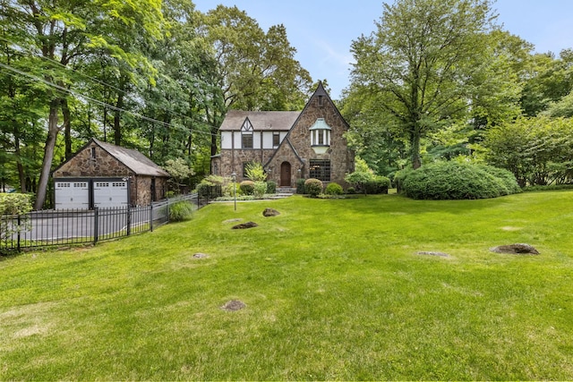 100 Mount Airy Rd S, Croton-On-Hudson, NY 10520 - tudor-style house with stone siding, a garage, and an outbuilding
