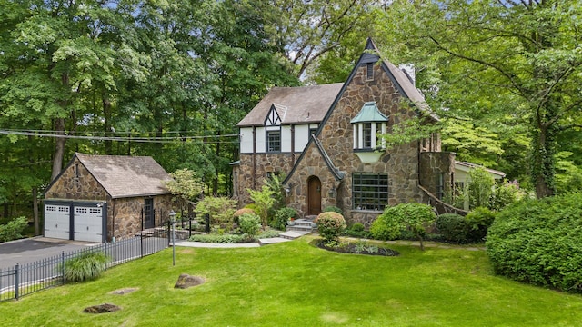 100 Mount Airy Rd S, Croton-On-Hudson, NY 10520 - tudor-style house featuring stone siding, a garage, an outbuilding, and stucco siding