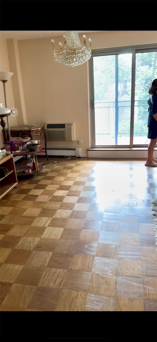 10 Ipswich Ave Unit 4M, Great Neck, NY 11021 - dining space featuring a chandelier and baseboard heating