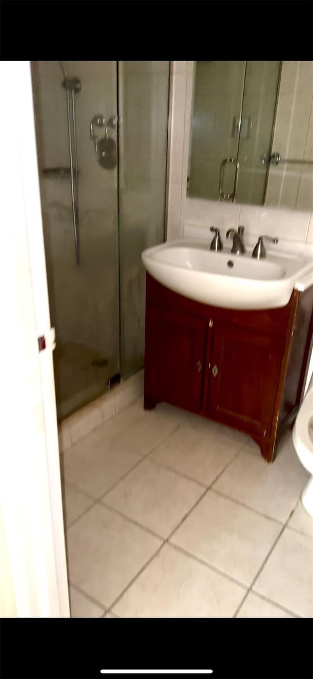 10 Ipswich Ave Unit 4M, Great Neck, NY 11021 - bathroom featuring a stall shower, tile patterned floors, and vanity