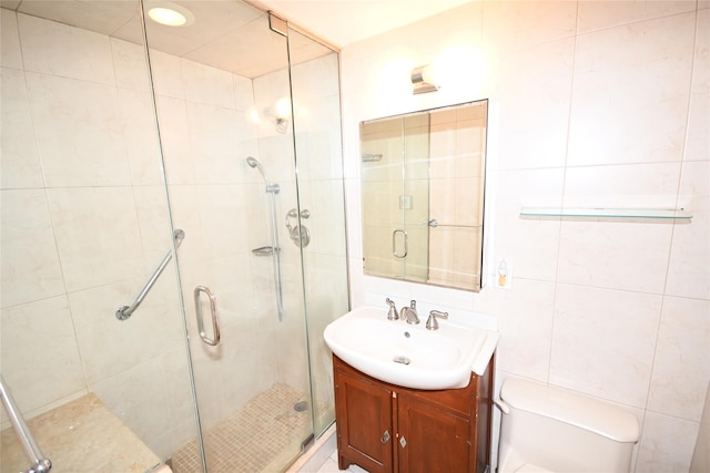 10 Ipswich Ave Unit 4M, Great Neck, NY 11021 - full bathroom with vanity, a shower stall, and tile walls
