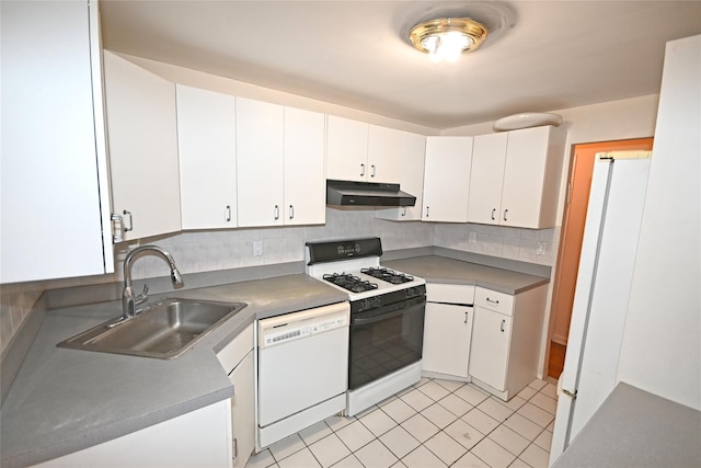 10 Ipswich Ave Unit 4M, Great Neck, NY 11021 - kitchen with white appliances, under cabinet range hood, white cabinetry, decorative backsplash, and light tile patterned floors