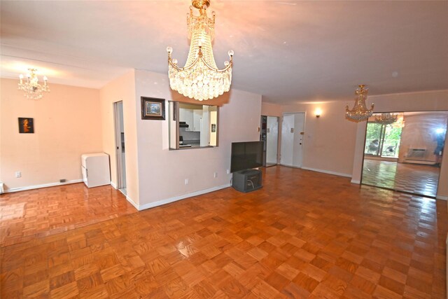 10 Ipswich Ave Unit 4M, Great Neck, NY 11021 - unfurnished living room with a chandelier
