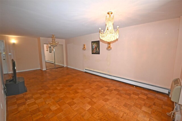 10 Ipswich Ave Unit 4M, Great Neck, NY 11021 - unfurnished living room featuring a chandelier, a baseboard radiator, and baseboard heating