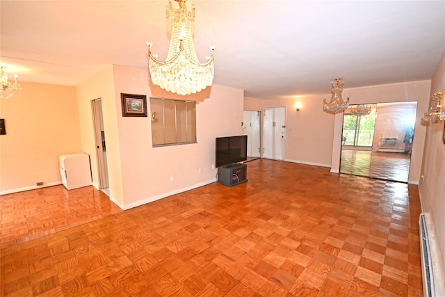 10 Ipswich Ave Unit 4M, Great Neck, NY 11021 - unfurnished living room featuring a chandelier and baseboard heating