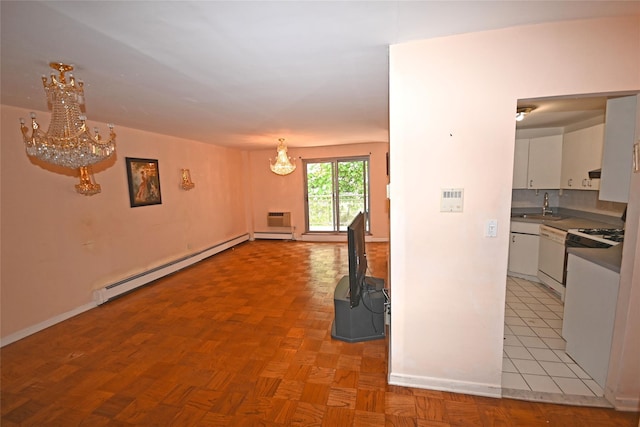 10 Ipswich Ave Unit 4M, Great Neck, NY 11021 - kitchen with a chandelier, a baseboard heating unit, white cabinets, and white appliances
