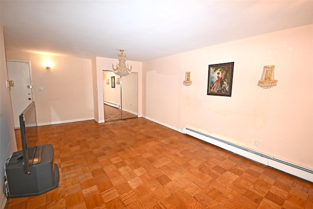 10 Ipswich Ave Unit 4M, Great Neck, NY 11021 - unfurnished living room with baseboard heating, a chandelier, and a baseboard heating unit