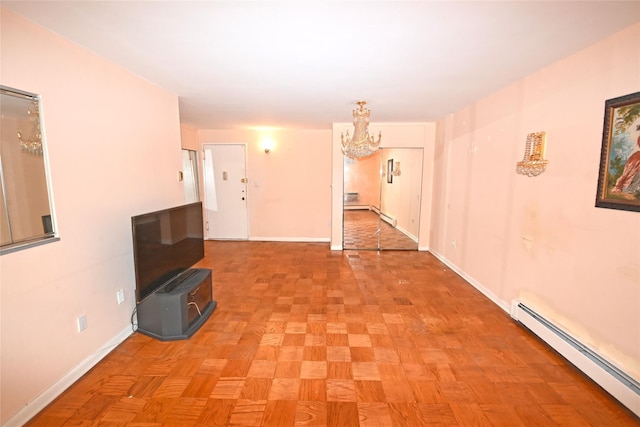 10 Ipswich Ave Unit 4M, Great Neck, NY 11021 - corridor featuring baseboard heating and a chandelier