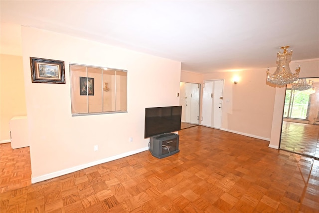10 Ipswich Ave Unit 4M, Great Neck, NY 11021 - unfurnished living room with a chandelier and baseboards