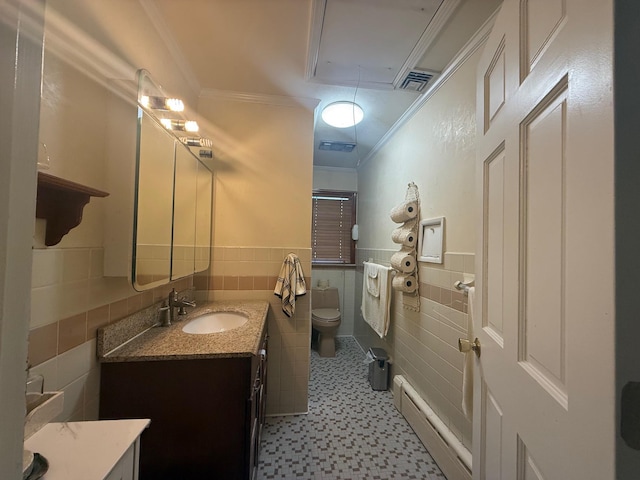 31 Stevenson Ave, Hartsdale, NY 10530 - bathroom featuring a baseboard radiator, ornamental molding, vanity, toilet, and tile walls