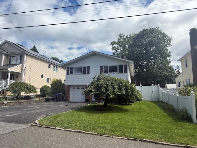 31 Stevenson Ave, Hartsdale, NY 10530 - view of front of home with driveway, a garage, a gate, and brick siding