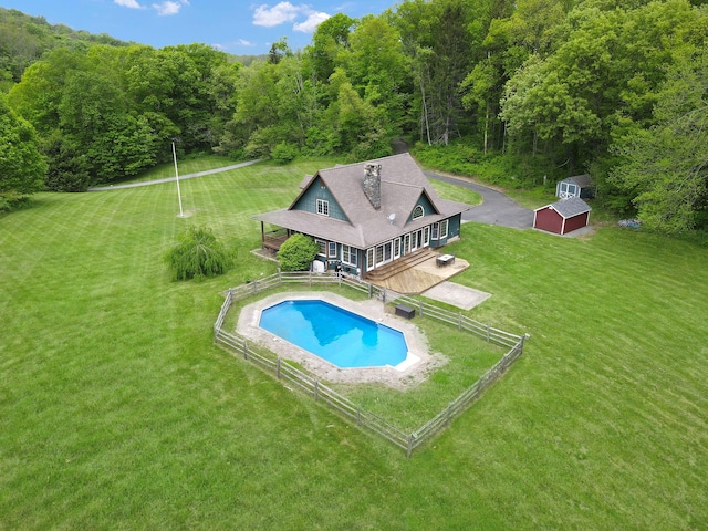 6843 Rte 55, Wingdale, NY 12594 - outdoor pool featuring an outdoor structure, a forest view, and a storage unit