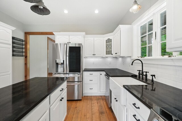 6843 Rte 55, Wingdale, NY 12594 - kitchen featuring stainless steel refrigerator with ice dispenser, a sink, dishwashing machine, white cabinets, and tasteful backsplash