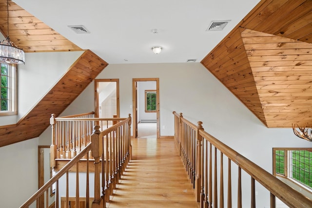 6843 Rte 55, Wingdale, NY 12594 - hall with an upstairs landing, light wood-type flooring, healthy amount of natural light, a chandelier, and wooden ceiling