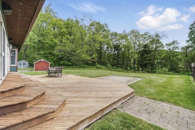 6843 Rte 55, Wingdale, NY 12594 - wooden deck with a storage shed, an outdoor structure, a lawn, and outdoor dining area