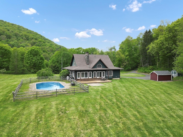 6843 Rte 55, Wingdale, NY 12594 - back of property featuring a wooded view, a shed, an outbuilding, and a chimney