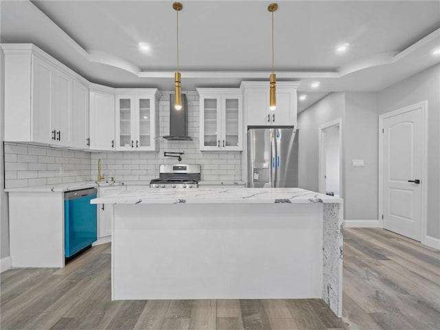 46 S 12th Ave, Mount Vernon, NY 10550 - kitchen with appliances with stainless steel finishes, wall chimney range hood, a tray ceiling, recessed lighting, and backsplash