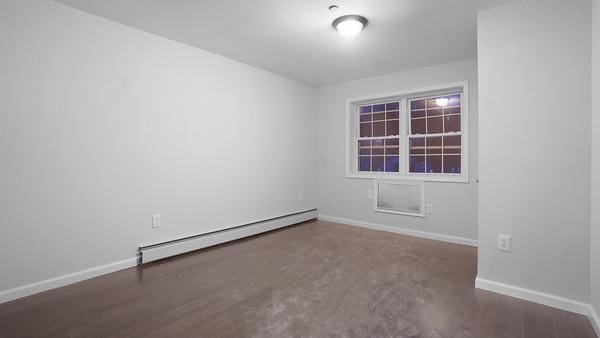 2040 Washington Ave, Bronx, NY 10457 - empty room featuring a baseboard heating unit and baseboards
