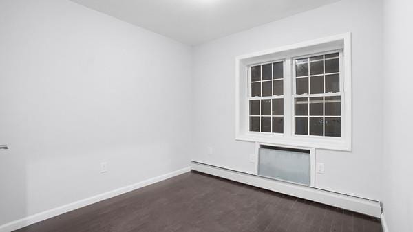 2040 Washington Ave, Bronx, NY 10457 - empty room with a baseboard radiator, baseboards, and wood finished floors