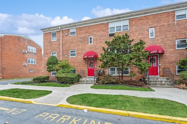 189 Drake Ave Unit 2A, New Rochelle, NY 10805 - view of front of property with uncovered parking and brick siding