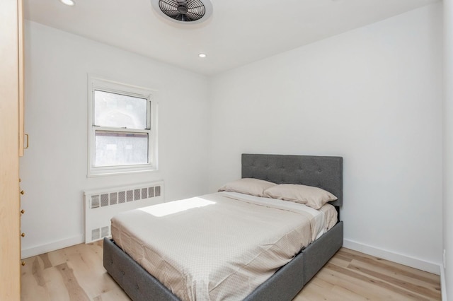 189 Drake Ave Unit 2A, New Rochelle, NY 10805 - bedroom featuring radiator heating unit, light wood-style flooring, baseboards, and recessed lighting