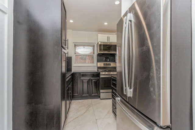 189 Drake Ave Unit 2A, New Rochelle, NY 10805 - kitchen with stainless steel appliances, light tile patterned floors, recessed lighting, and dark cabinets