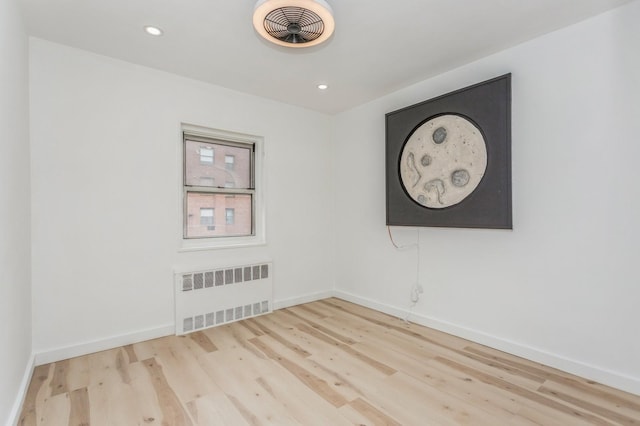 189 Drake Ave Unit 2A, New Rochelle, NY 10805 - unfurnished room with radiator, wood finished floors, baseboards, and recessed lighting