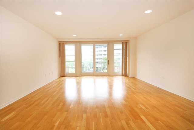 100 Harbor View Dr SW Unit 335, Port Washington, NY 11050 - empty room with light wood finished floors, recessed lighting, and baseboards