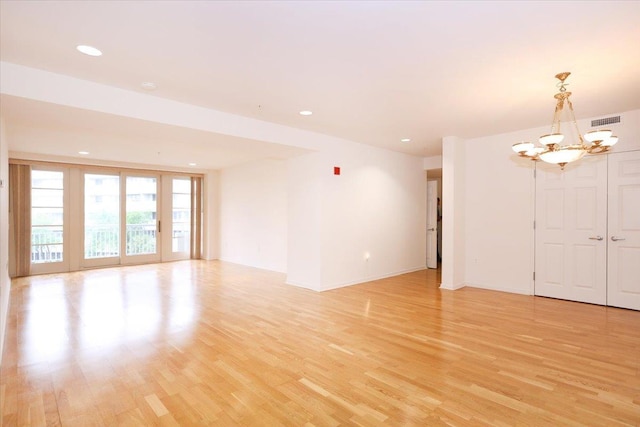 100 Harbor View Dr SW Unit 335, Port Washington, NY 11050 - spare room with a chandelier, light wood-type flooring, recessed lighting, and baseboards