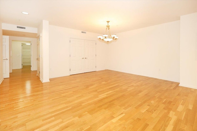 100 Harbor View Dr SW Unit 335, Port Washington, NY 11050 - spare room featuring a chandelier, light wood-style floors, recessed lighting, and baseboards