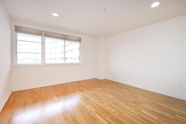 100 Harbor View Dr SW Unit 335, Port Washington, NY 11050 - unfurnished room with light wood-type flooring, baseboards, and recessed lighting