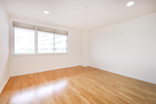 100 Harbor View Dr SW Unit 335, Port Washington, NY 11050 - spare room with light wood-type flooring, baseboards, and recessed lighting