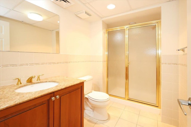 100 Harbor View Dr SW Unit 335, Port Washington, NY 11050 - full bathroom with tile walls, tile patterned floors, vanity, a stall shower, and toilet