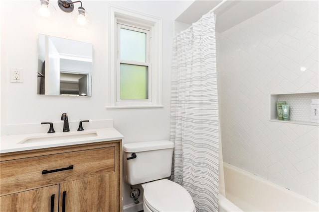 bathroom featuring toilet, vanity, and shower / bath combination with curtain