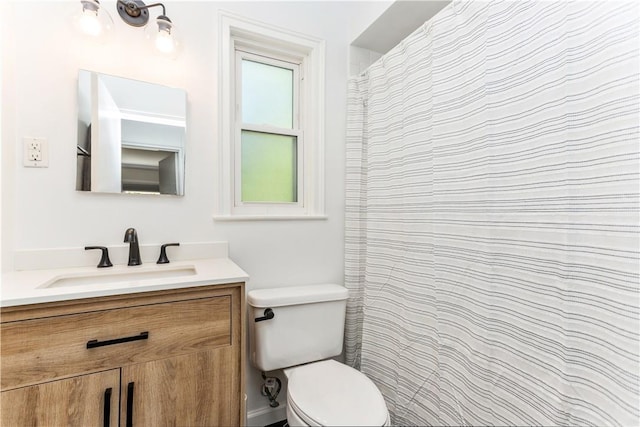 full bathroom featuring toilet and vanity