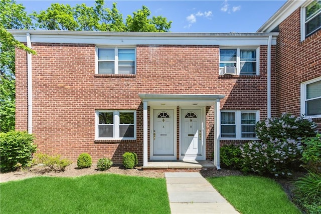 view of property with brick siding