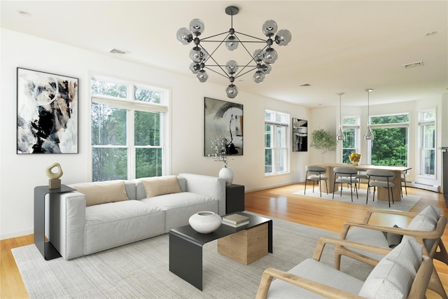9 Golf Course Dr, Suffern, NY 10901 - living room with a chandelier, light wood finished floors, and a baseboard radiator