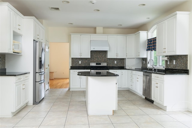 9 Golf Course Dr, Suffern, NY 10901 - kitchen with appliances with stainless steel finishes, custom range hood, a sink, a kitchen island, and white cabinets