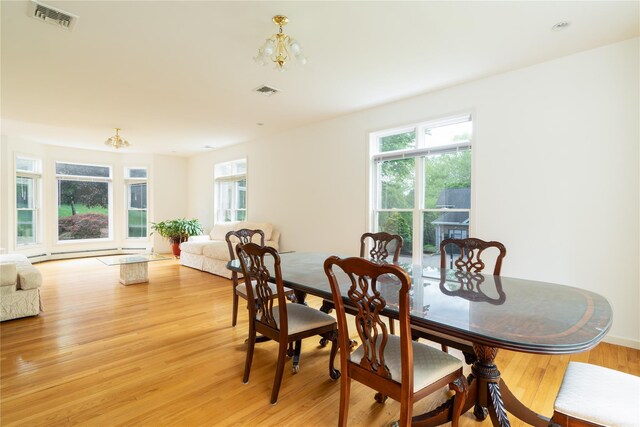 9 Golf Course Dr, Suffern, NY 10901 - dining area featuring a chandelier and light wood-type flooring